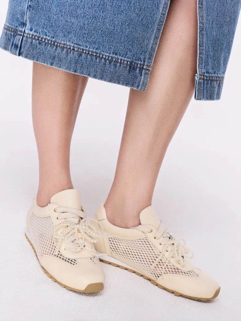 Leather cream sneakers with decorative tags