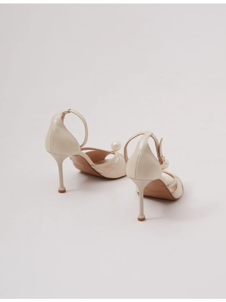 Cream-colored heeled sandals with pearl detailing