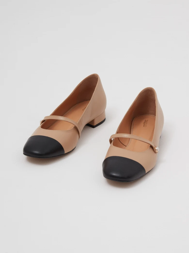 Two-tone leather ballet flats with a decorative strap