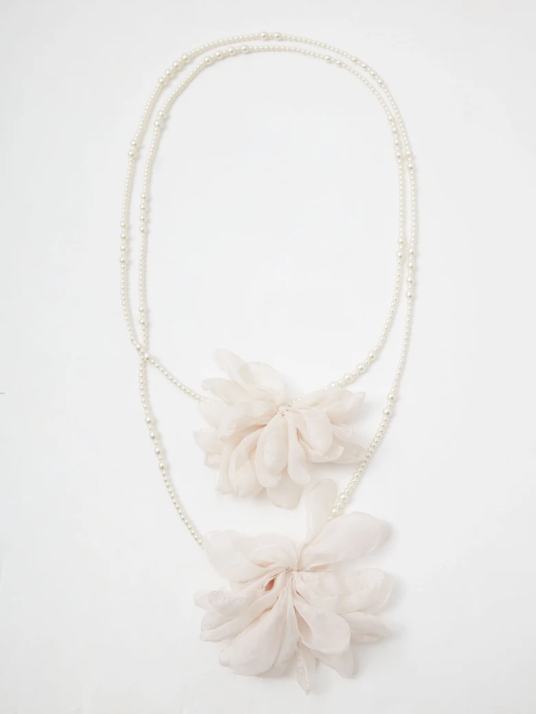 Double necklace made of glass pearls with flowers