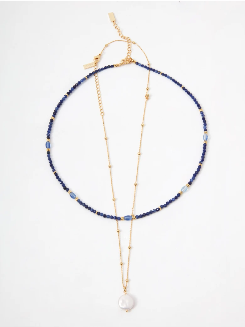 A set of two beaded necklaces with gold-colored pendants