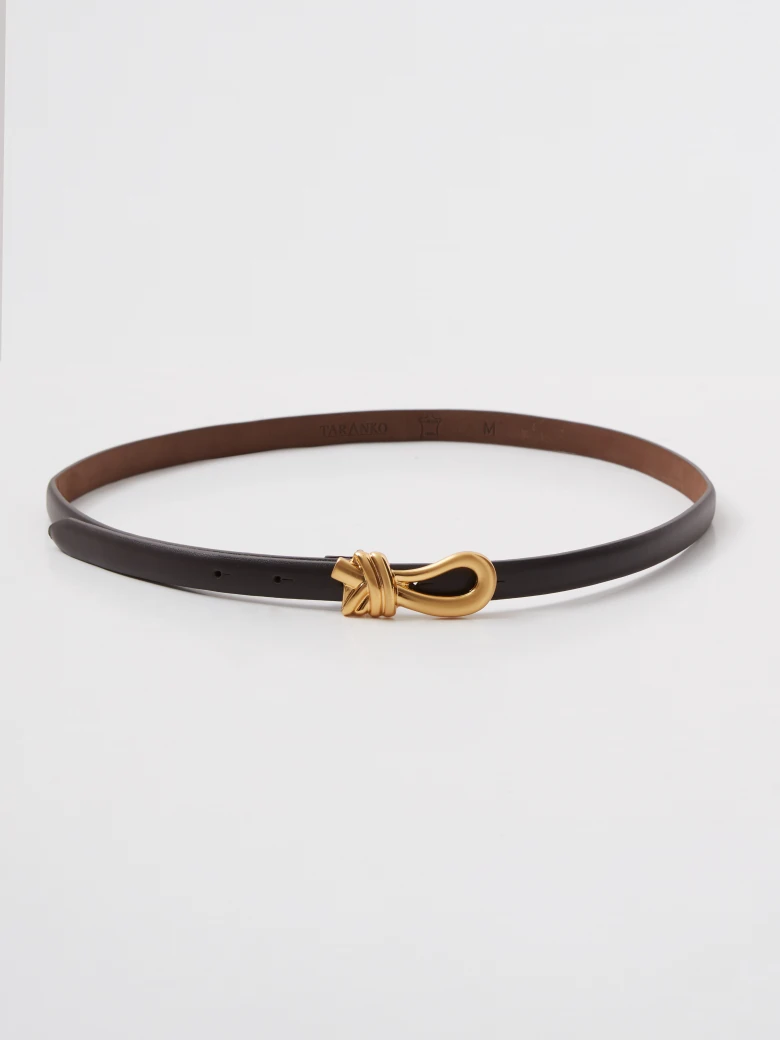 Leather belt with a decorative buckle