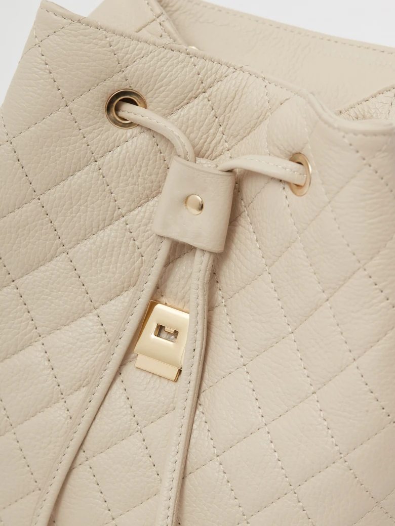 Cream quilted leather backpack