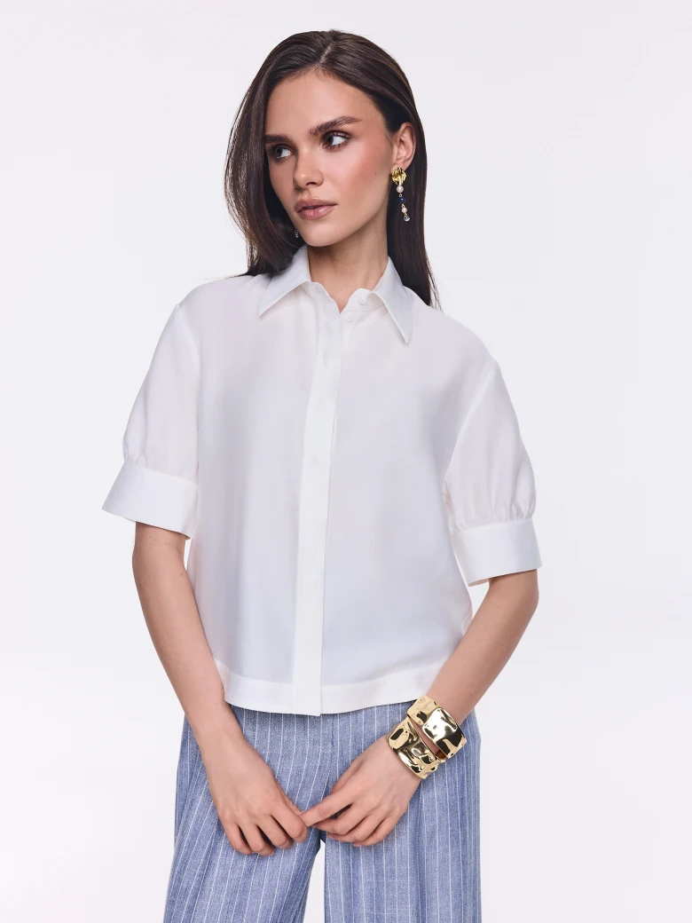 An elegant white short-sleeved shirt