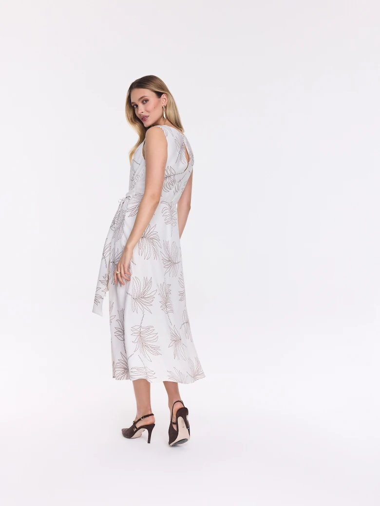 White midi dress with a leaf pattern