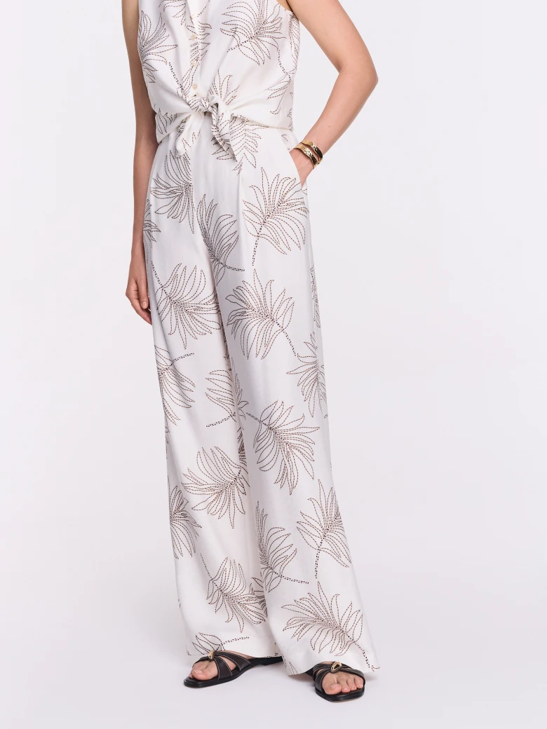 White wide-leg pants with a floral print