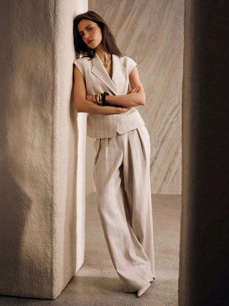 Light beige high-waisted ribbed trousers