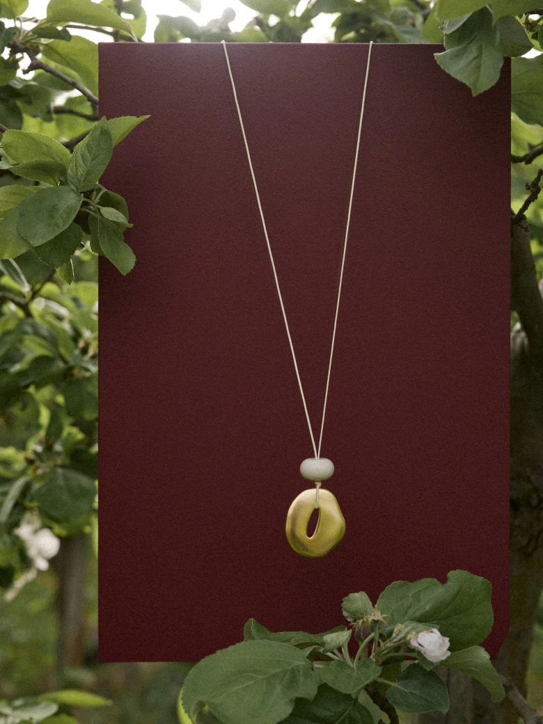 A minimalist gold-coloured necklace