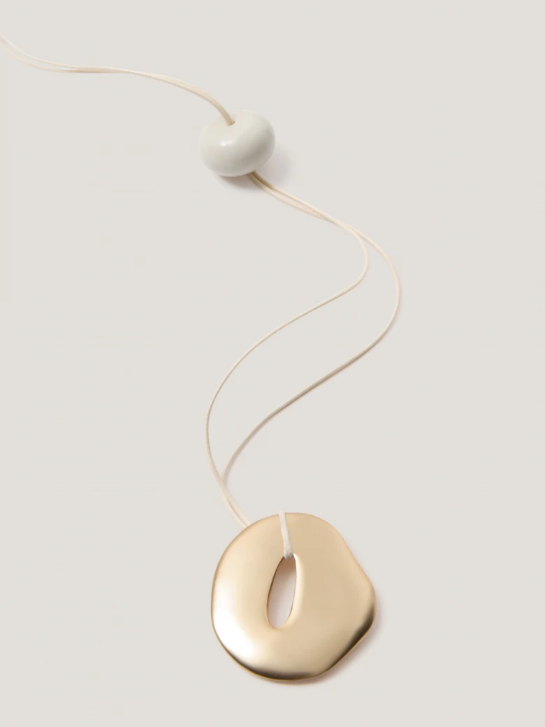 A minimalist gold-coloured necklace