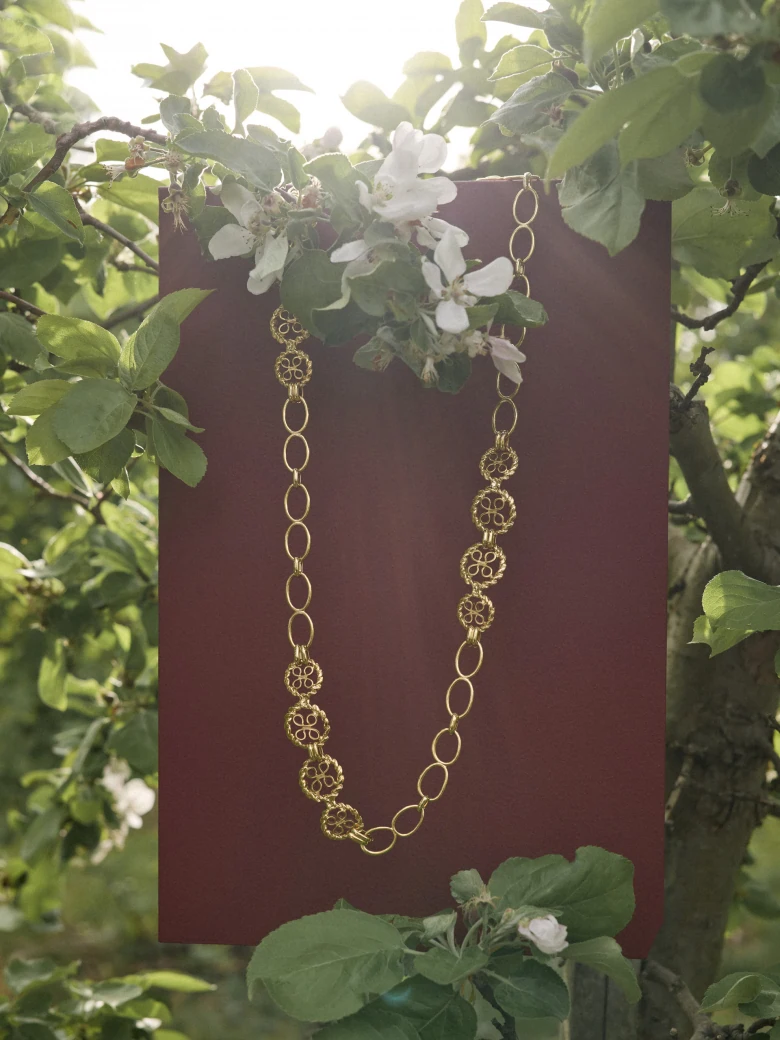 A metal strap with decorative links