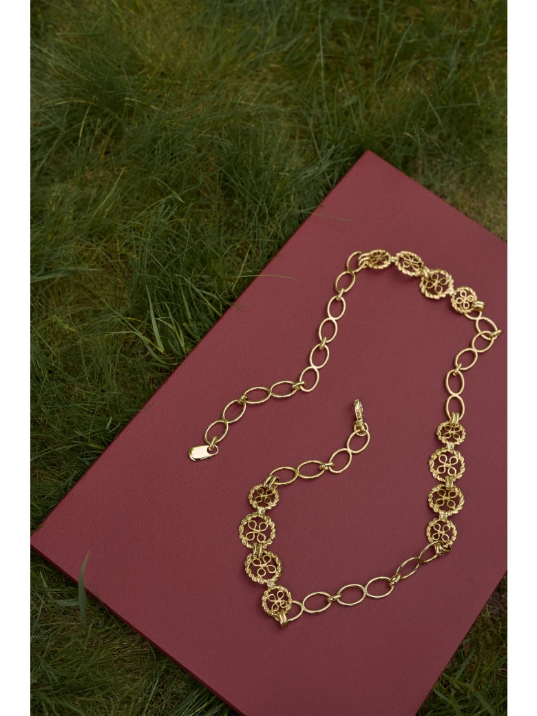 A metal strap with decorative links