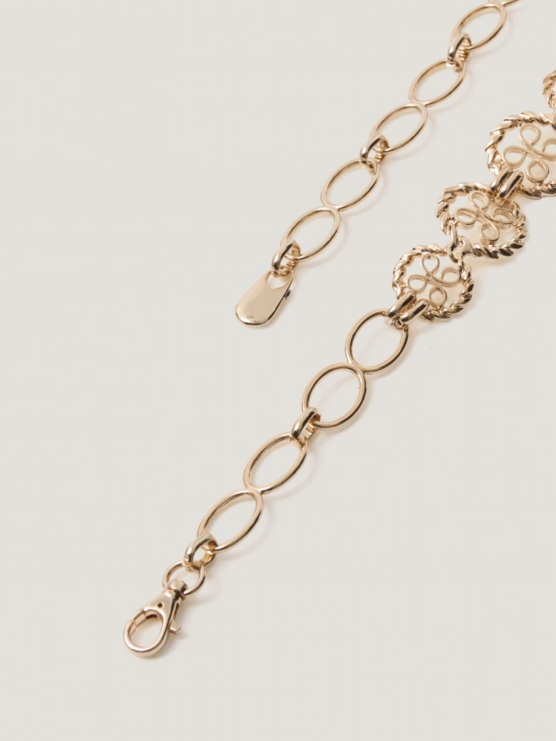 A metal strap with decorative links