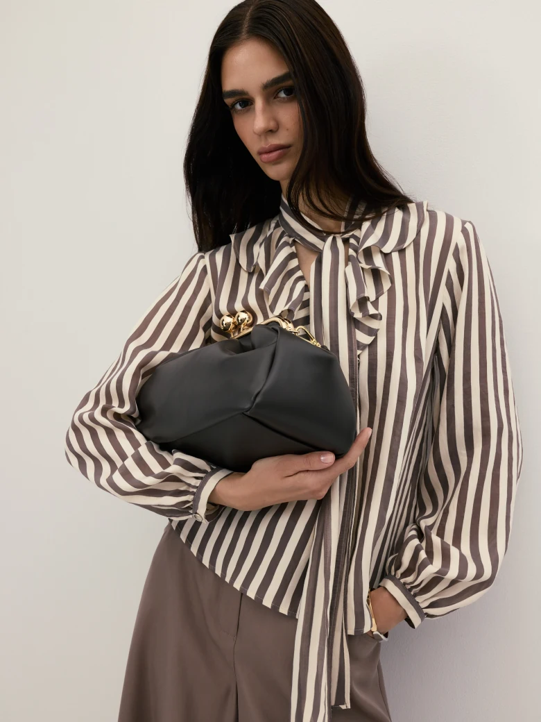 A dark chocolate-coloured leather handbag